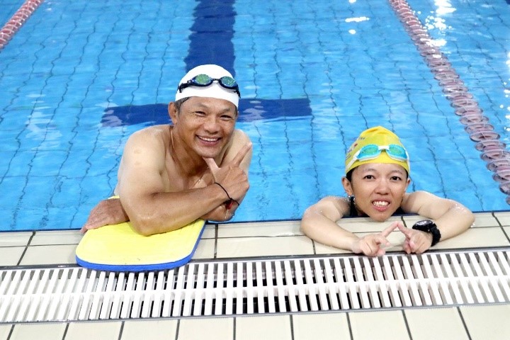 Wei and her dad at swimming pool